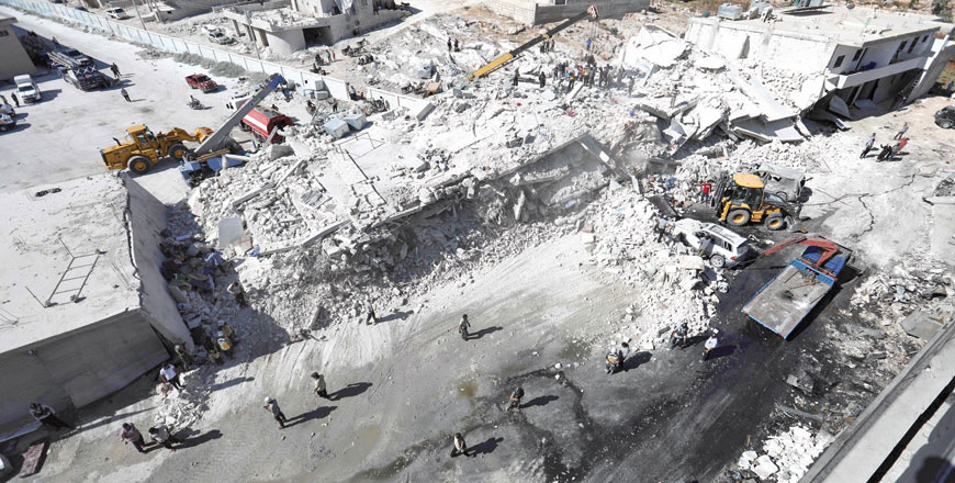 Destroyed buildings are seen on Sunday following an explosion at an arms depot in a residential area in Syria's northern Idlib province city of Sarmada, in which 12 people were reportedly killed (AFP photo)