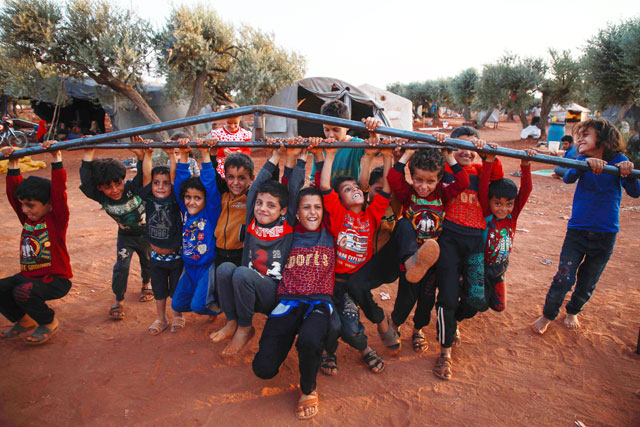 Children play with the frame of a tent at a camp for the displaced near the town of Hazzanu, about 20 kilometres northwest of the city of Idlib, on September 30 (AFP photo)