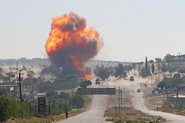 A fireball erupts from the site of an explosion reportedly targeting a joint Turkish-Russian patrol on the strategic M4 highway, near the Syrian town of Ariha in the rebel-held northwestern Idlib province, on Tuesday (AFP photo)