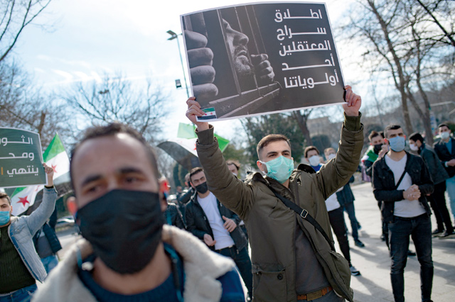   People rally as they mark the 10th anniversary of the start of the war in Syria, on Saturday, in Istanbul (AFP photo)