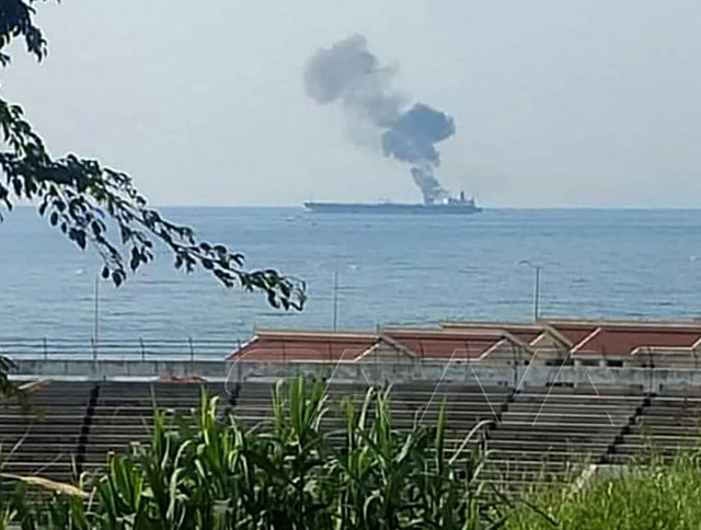 This handout photo released by the official Syrian Arab News Agency, on Saturday, shows smoke billowing from a tanker off the coast of the western Syrian city of Baniyas  (AFP photo)