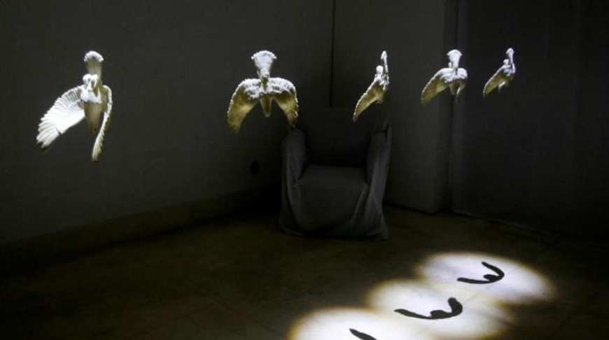 Gulnar Sarikhi hung the doves upside down as a symbol of the Syrian people's helplessness (AFP photo)