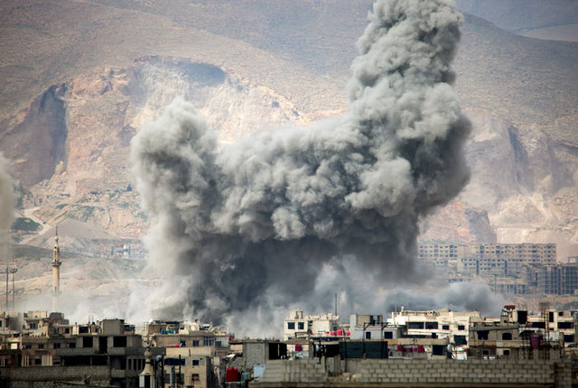 Smoke billows following a reported air strike in the rebel-held parts of the Jobar district, on the eastern outskirts of the Syrian capital Damascus, on Monday (AFP photo)