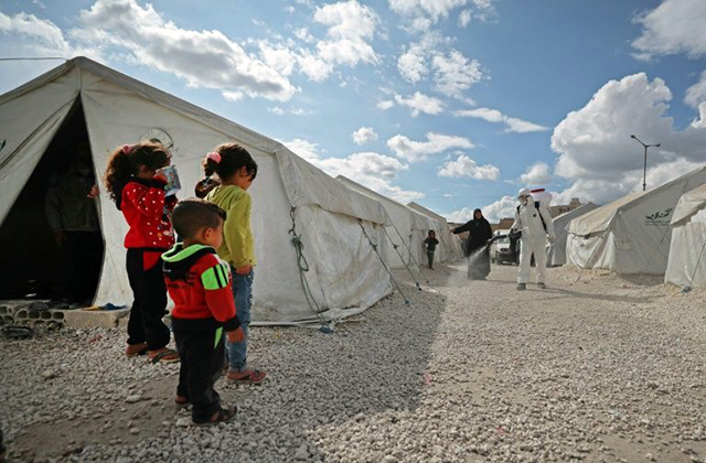Physical distancing is impossible in camps for refugees and displaced persons, say aid agencies (AFP photo)
