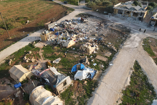This aerial view shows destruction in the aftermath of a Russian air strike at a camp for those displaced by conflict on the outskirts of the rebel-held village of Al Hamamah in the district of Jisr Al Shughur in the west of Syria’s north-western Idlib province on Tuesday (AFP photo)