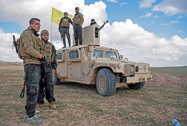 US-backed Syrian Democratic Forces (SDF) fighters gather as they prepare to expel hundreds of the Daesh terrorists from the Baghouz area in the eastern Syrian province of Deir Ezzor on Monday (AFP photo)