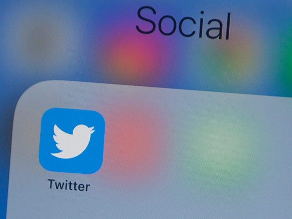 Twitter logo is seen on a phone in this photo illustration in Washington, DC, on July 10, 2019 (AFP photo)