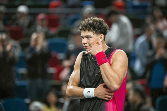 US’s Ben Shelton gestures after his win against Italy’s Jannik Sinner in their men’s singles match during the Shanghai Masters tennis tournament in Shanghai on Tuesday (AFP photo)