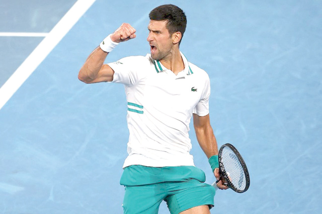 Serbia’s Novak Djokovic reacts as he plays against Russia’s Aslan Karatsev during their men’s singles semifinal match on day eleven of the Australian Open in Melbourne, February 18 (AFP photo)