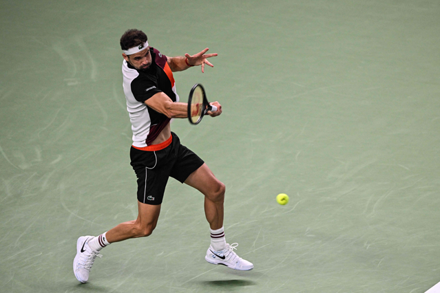 Bulgaria’s Grigor Dimitrov hits a return to Spain’s Carlos Alcaraz during their men’s singles match at the Shanghai Masters tennis tournament in Shanghai on Wednesday (AFP photo)