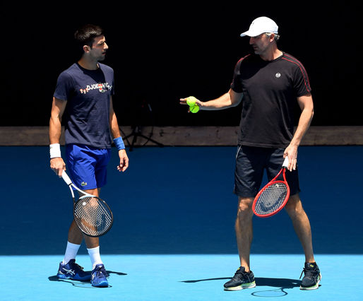 Novak Djokovic of Serbia talks with coach Goran Ivanisevic (right) during a practice session at the Melbourne Park tennis centre on Wednesday (AFP photo by William West)