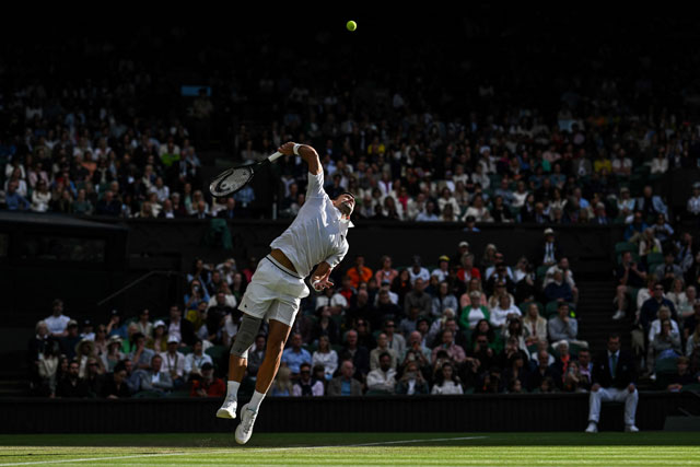 Serbia’s Novak Djokovic serves the ball to Australia’s Alexei Popyrin during their men’s singles tennis match on the sixth day of the 2024 Wimbledon Championships at The All England Lawn Tennis and Croquet Club in Wimbledon, southwest London, on Saturday (AFP photo)