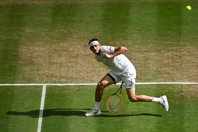 US player Taylor Fritz returns against Italy’s Lorenzo Musetti during their men’s singles quarter-finals tennis match on the tenth day of the 2024 Wimbledon Championships at The All England Lawn Tennis and Croquet Club in Wimbledon, southwest London, on Wednesday (AFP photo)