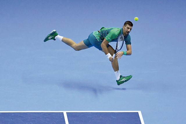 Serbia’s Novak Djokovic returns to Denmark’s Holger Rune during their first round-robin match at the ATP Finals tennis tournament in Turin on Monday (AFP photo)
