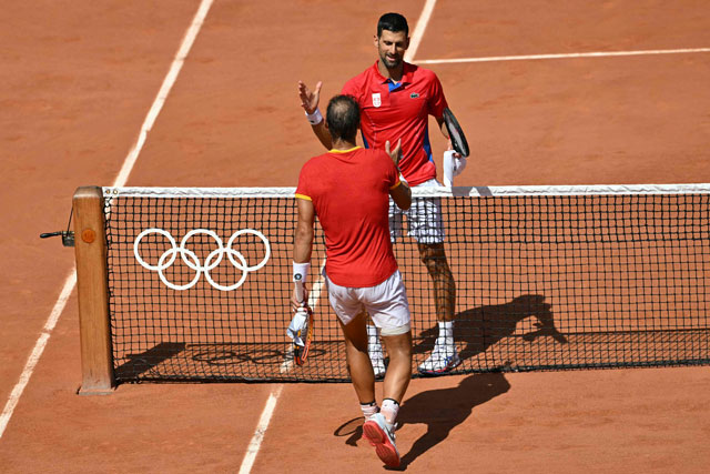 Winner, Serbia’s Novak Djokovic (right) shakes hands with Spain’s Rafael Nadal  after their men’s singles second round tennis match on Court Philippe-Chatrier at the Roland-Garros Stadium at the Paris 2024 Olympic Games, in Paris on Monday (AFP photo)