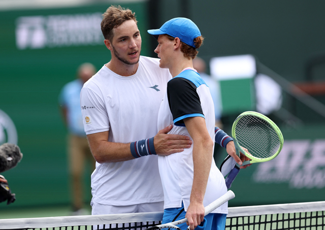 Jannik Sinner of Italy shakes hands at the net after his straight sets victory against Jan-Lennard Struff of Germany in their third round match during the BNP Paribas Open at Indian Wells Tennis Garden on Sunday in Indian Wells, California (AFP photo)