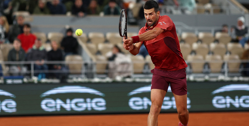 Serbia’s Novak Djokovic plays a backhand return to Italy’s Lorenzo Musetti during their men’s singles match on Court Philippe-Chatrier on day seven of the French Open tennis tournament at the Roland Garros Complex in Paris on Sunday (AFP photo)