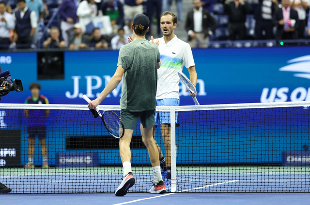 Italy’s Jannik Sinner (left) and Russia’s Daniil Medvedev meet at the net after Sinner won the men’s quarterfinals match on day ten of the US Open tennis tournament at the USTA Billie Jean King National Tennis Centre in New York City, on Thursday (AFP photo)