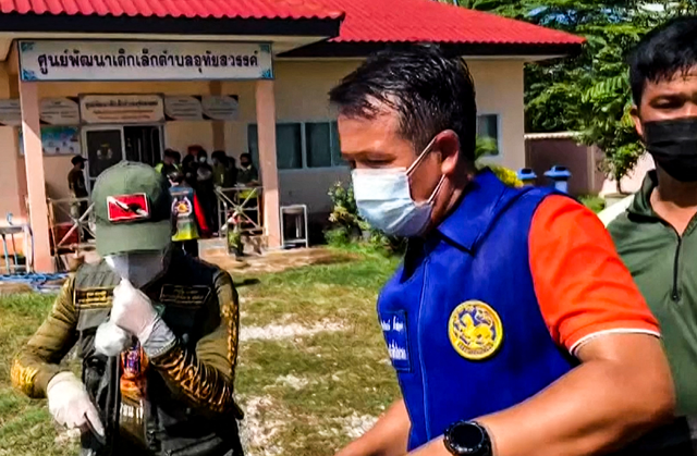 This frame grab from video footage by Thai PBS made available via AFPTV and taken on Thursday shows officials outside a nursery in the northern Thai province of Nong Bua Lam Phu, where a former policeman shot dead at least 30 people in a mass shooting (AFP photo)