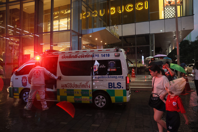 An ambulance is seen outside Siam Paragon shopping centre in Bangkok on Tuesday, following a shooting incident in the mall (AFP photo)
