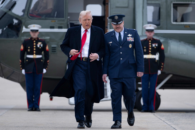 US President Donald Trump is greeted as he steps off Marine One at Joint Base Andrews in Maryland on March Saturday (AFP photo)