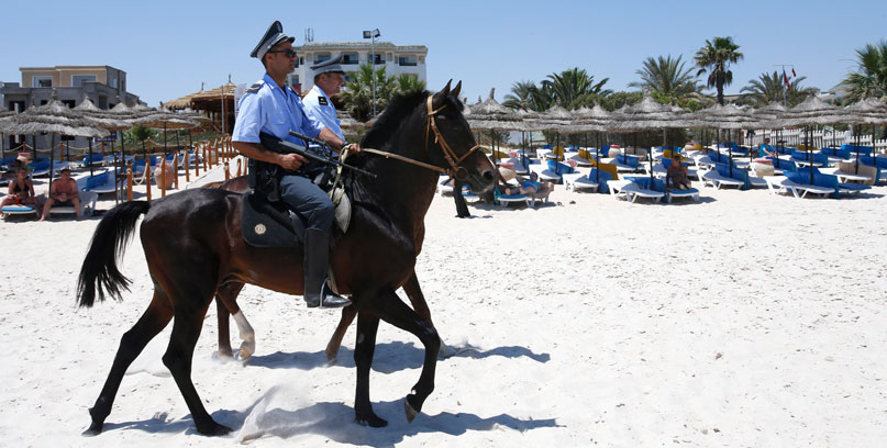 In this June 28, file photo, mounted police officers patrol on the beach of  Sousse, Tunisia (AP photo)