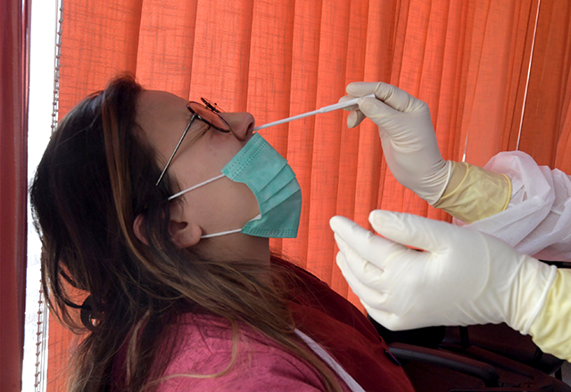 Saida Zelfani, a physician of SAMU Tunisia (Urgent Medical Aid Service) dressed in personal protective equipment (PPE) attire as a measure of protection against the COVID-19 (AFP photo)