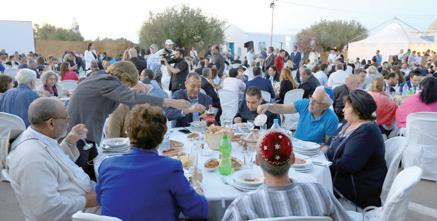 Muslims take part in an Iftar dinner, the meal after sunset during the Muslim holy month of Ramadan, during an event organised by Jews of Djerba, on the first day of the annual Jewish pilgrimage to El Ghriba Synagogue, the oldest Jewish monument built in Africa, on the Mediterranean resort island of Djerba, on Wednesday (AFP photo)
