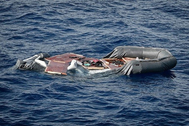 A file photo showing a deflated rubber boat in seen at the sea, after the Libyan coast guard intercepted migrants aboard, some 25km off the Libyan coast, on May 8, 2018 (AFP photo)