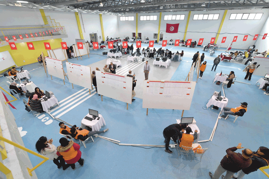 Members of the Tunisian electoral commission count votes on Sunday in Tunis (AFP photo)