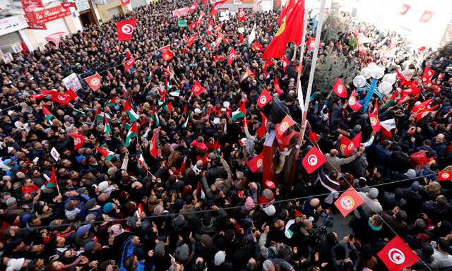 People shout slogans during a nationwide strike against the government's refusal to raise wages in Tunis, Tunisia, on Thursday (Reuters photo)