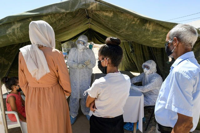 People queue to get tested for coronavirus at the field hospital in El Hamma. The town's hospital has no intensive care beds, and the army set up the field hospital in mid-August to bolster the local response and screen suspected cases (AFP photo)