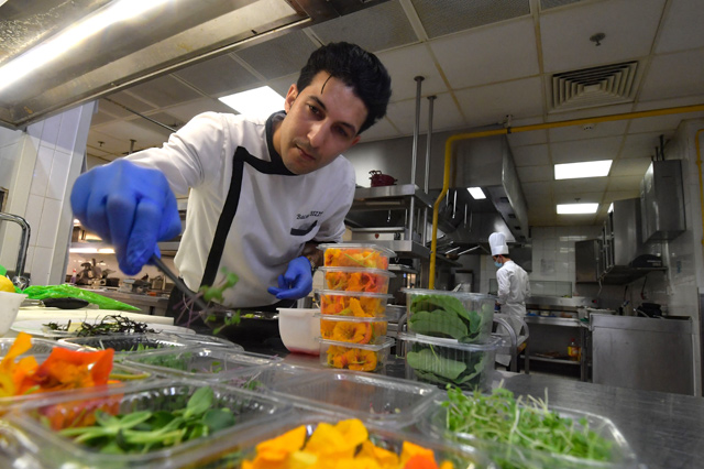 Tunisian chef Bassem Bizid uses edible flowers to prepare his dishes at a luxury hotel in Gammarth, an upscale northern suburb of the capital Tunis, on February 5 (AFP photo)