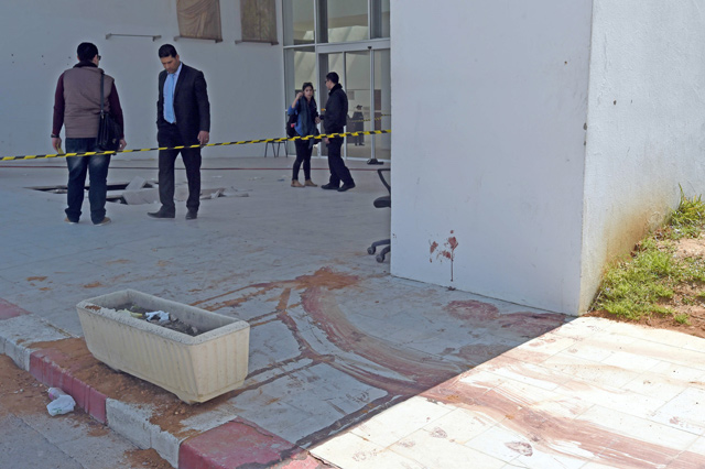 In this file photo blood stains the ground at the visitors entrance of the National Bardo Museum in Tunis on March 19, 2015, in the aftermath of an attack on foreign tourists in the Tunisian capital (AFP photo)