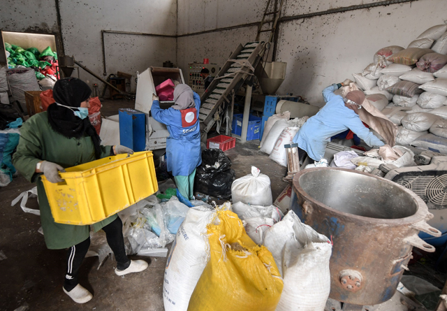 Employees of AFREC African Recycling work at the recycling facility in the industrial zone of Mghira, near the Tunisian capital Tunis, on November 25 (AFP photo)