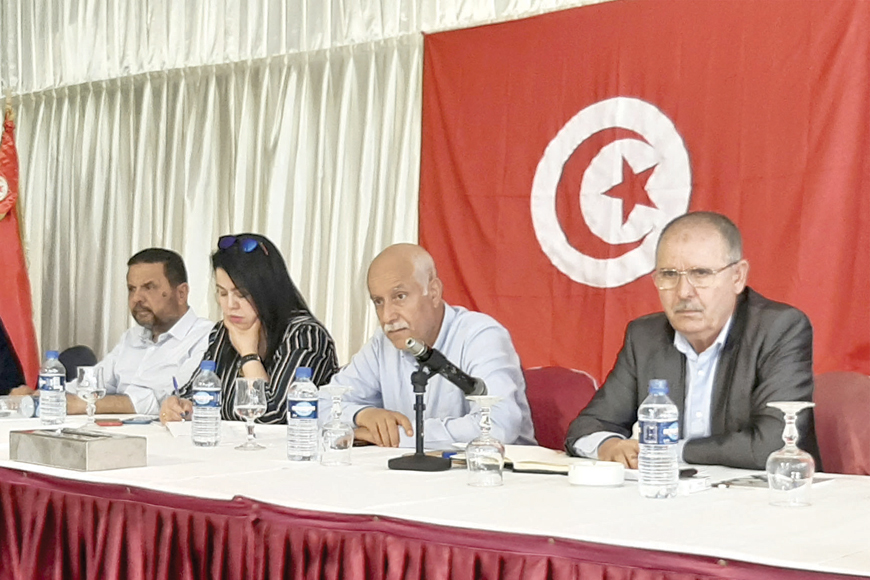 Noureddine Taboubi (right), secretary general of the Tunisian General Labour Union, chairs the meeting of the body's national administrative commission in Hammamet, on Monday (AFP photo)