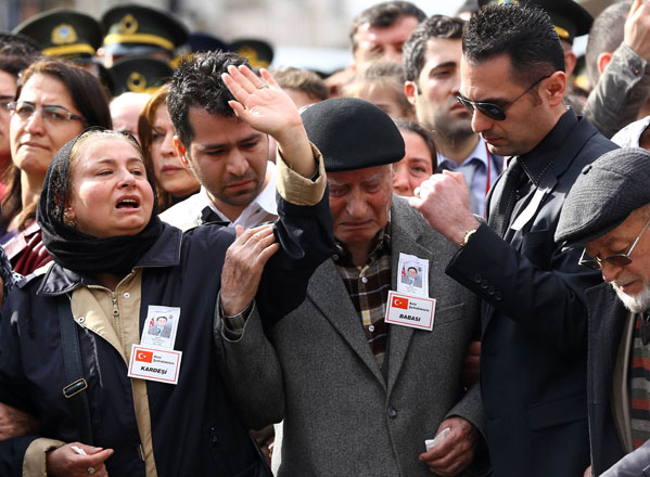 Family members mourn during a funeral ceremony for the victims of the February 17 car bombing at Kocatepe Mosque in Ankara on Friday (AFP photo)