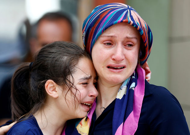 Relatives of one of the victims of Tuesday’s blast at Istanbul’s Ataturk Airport mourn in front of a morgue in Istanbul, Turkey, on Wednesday (Reuters photo)