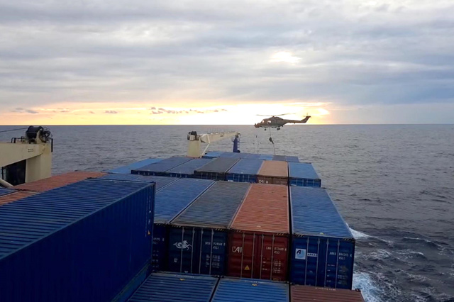 A screen grab made from a video released by Demiroren News Agency shows a German soldier landing from a helicopter on a Turkish cargo ship on Monday at east Mediterranean Sea (AFP photo)