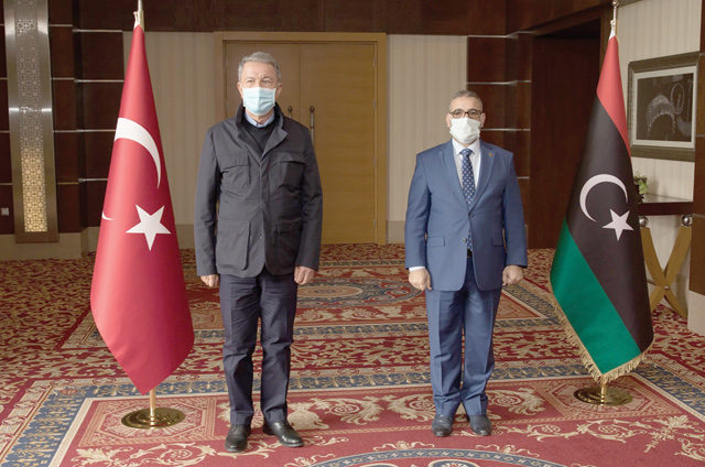 Turkish Minister of Defence Hulusi Akar (left) meets with President of the Libyan High State Council Khalid Al Mishri in the capital Tripoli, on Saturday (AFP photo)