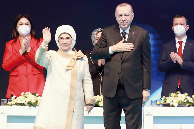 Turkish president and leader of Justice and Development (AK) Party, Recep Tayyip Erdogan (right) and his wife Emine Erdogan arrive on stage during a political meeting of the ruling party AKP, in Ankara, on Wednesday (AFP photo)