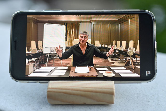 A photograph taken on Wednesday in Istanbul shows on a mobile phone Sedat Peker speaking on his YouTube channel (AFP photo)