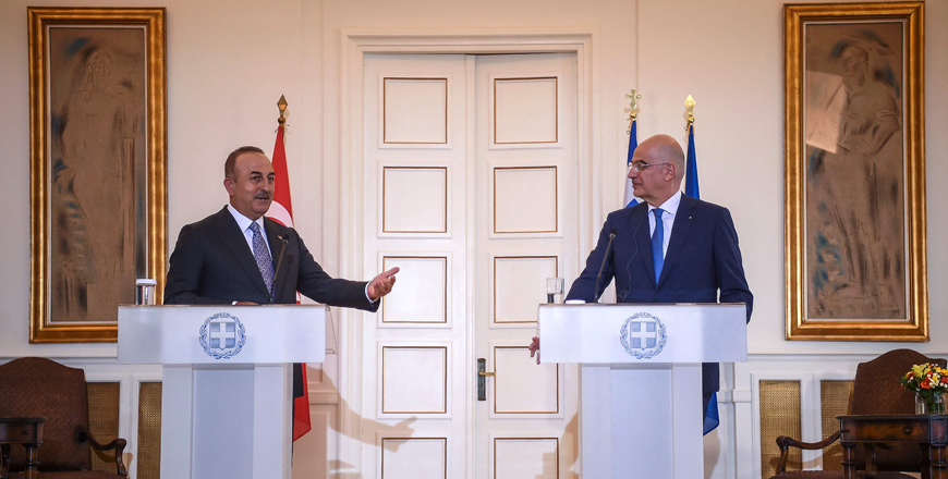 Greek Foreign Minister Nikos Dendias (right) and his Turkish counterpart Mevlut Cavusoglu hold a press conference after their meeting in Athens, on Monday  (AFP photo)