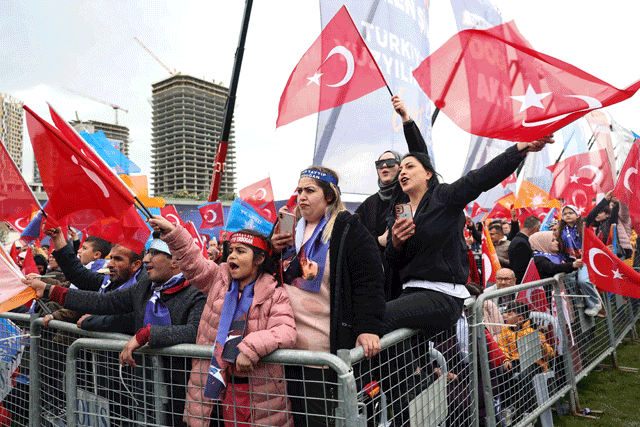 Supporters of Turkish President Recep Tayyip Erdogan wave Turkish flags and cheer during his election campaign rally in Ankara, on Sunday (AFP photo)