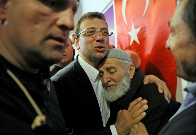 Ekrem Imamoglu, main opposition Republican People’s Party candidate for mayor of Istanbul, embraces his supporter at his election campaign office in Istanbul, Turkey, on Monday (Reuters photo)