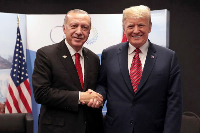 Turkey’s President Recep Tayyip Erdogan and US President Donald Trump, pictured at the G-20 summit earlier this month, have agreed to ‘more effective coordination’ on Syria (AFP photo)