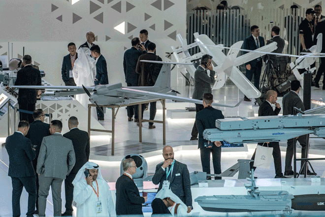 Visitors tour in a showroom by mockups of products by Turkish defence corporation Aselsan during the International Defence Exhibtion (IDEX) at the Abu Dhabi International Exhibition Centre, on Monday (AFP photo)