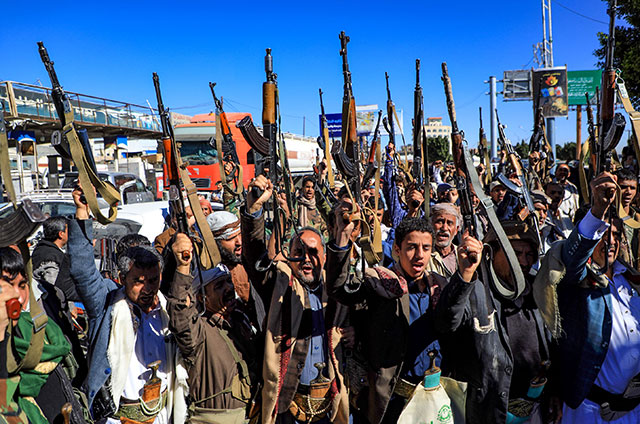 Armed Yemeni supporters of the Iran-backed Houthi movement, brandish their weapons as they rally in the capital Sanaa to protest against the Saudi-led coalition's intervention in their country, on Thursday (AFP photo)