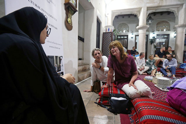 Tourists talk to an Emirati woman volunteer to learn about Ramadan and Emirati culture during the Muslim holy fasting month of Ramadan, at the Sheikh Mohammed Centre for Cultural Understanding in Dubai, UAE, on Friday (Reuters photo)