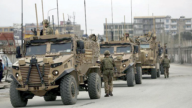 British soldiers with NATO-led Resolute Support Mission forces arrive at the site of an attack in Kabul, Afghanistan, March 25, 2020 (AFP photo)